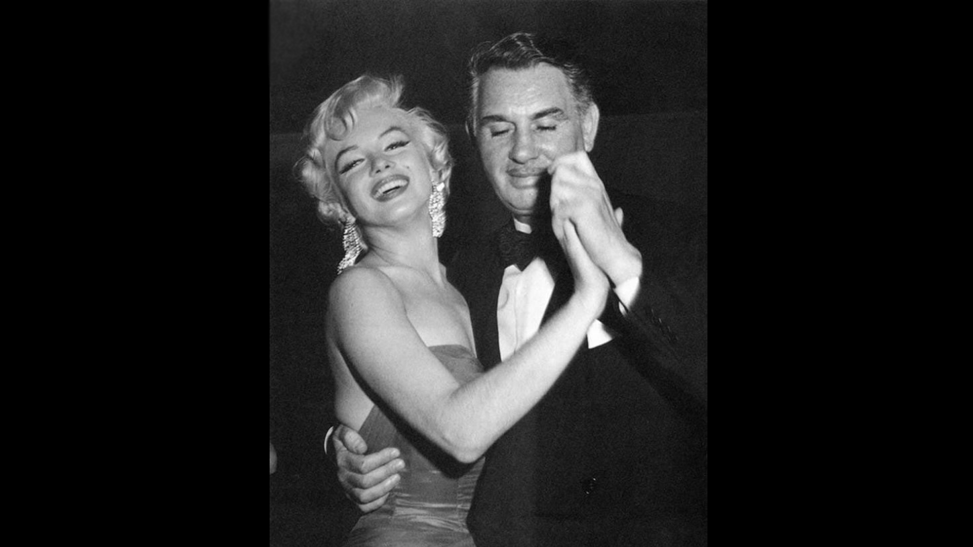 Charles Feldman dancing with Marilyn Monroe
