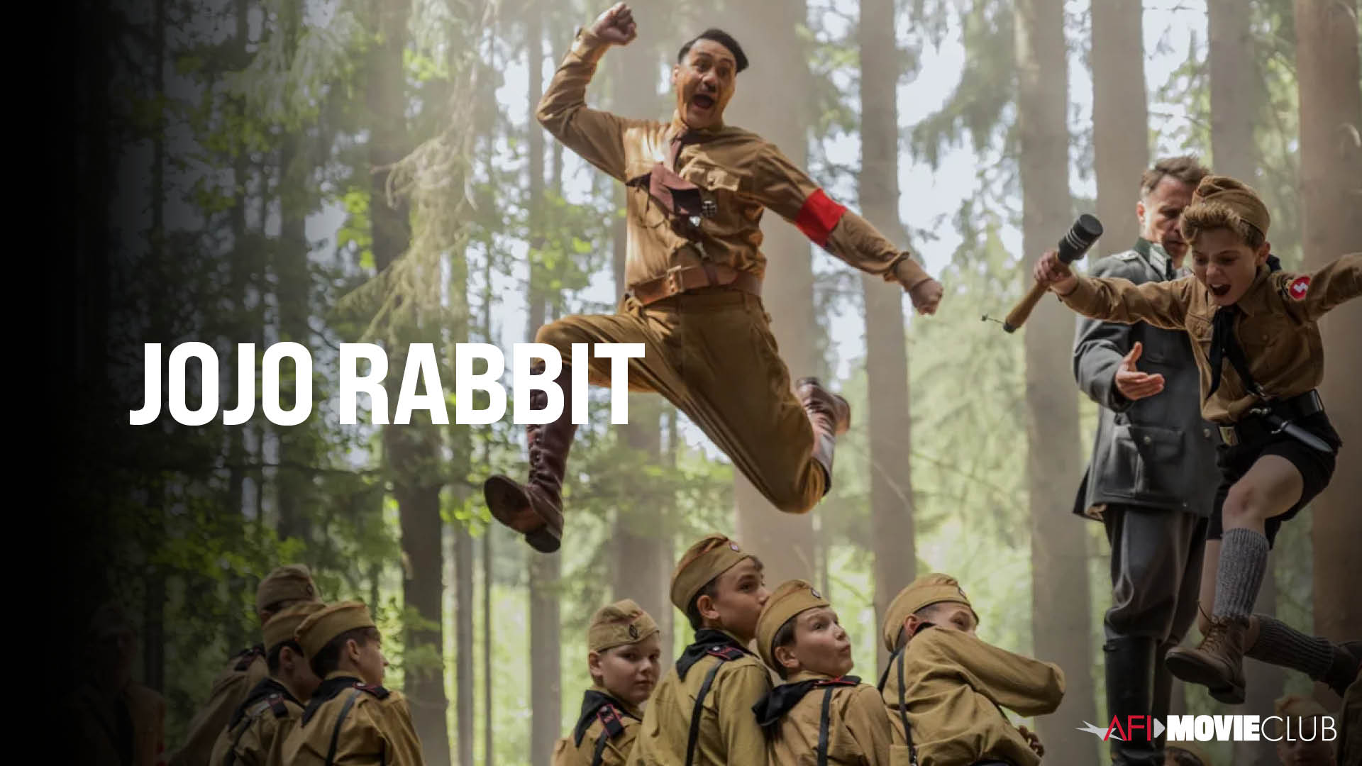 Jojo Rabbit Film Still - Sam Rockwell, Taika Waititi, and Roman Griffin Davis