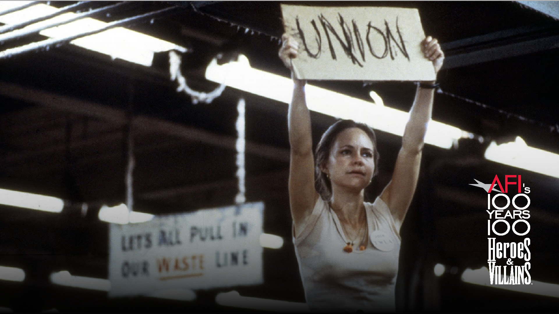 Film still of Sally Field holding up a "Union" sign in the film NORMA RAE