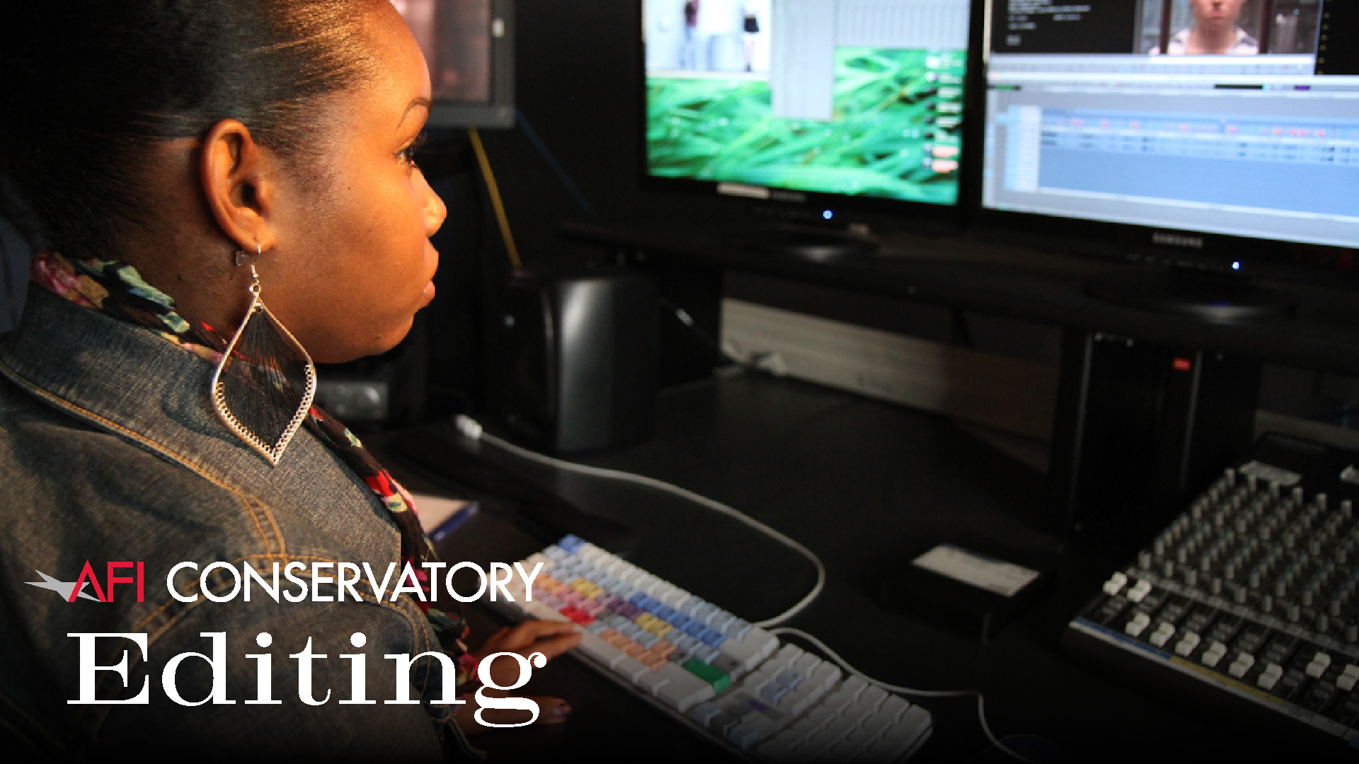 A female AFI Fellow at the AFI Conservatory editing a digital video project at one of the film school's editing stations featuring multiple monitors