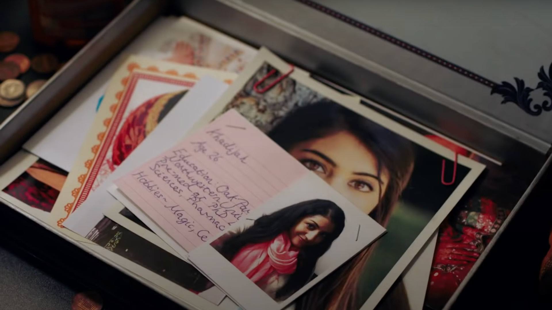 THE BIG SICK film still of a pile of photographs and notes