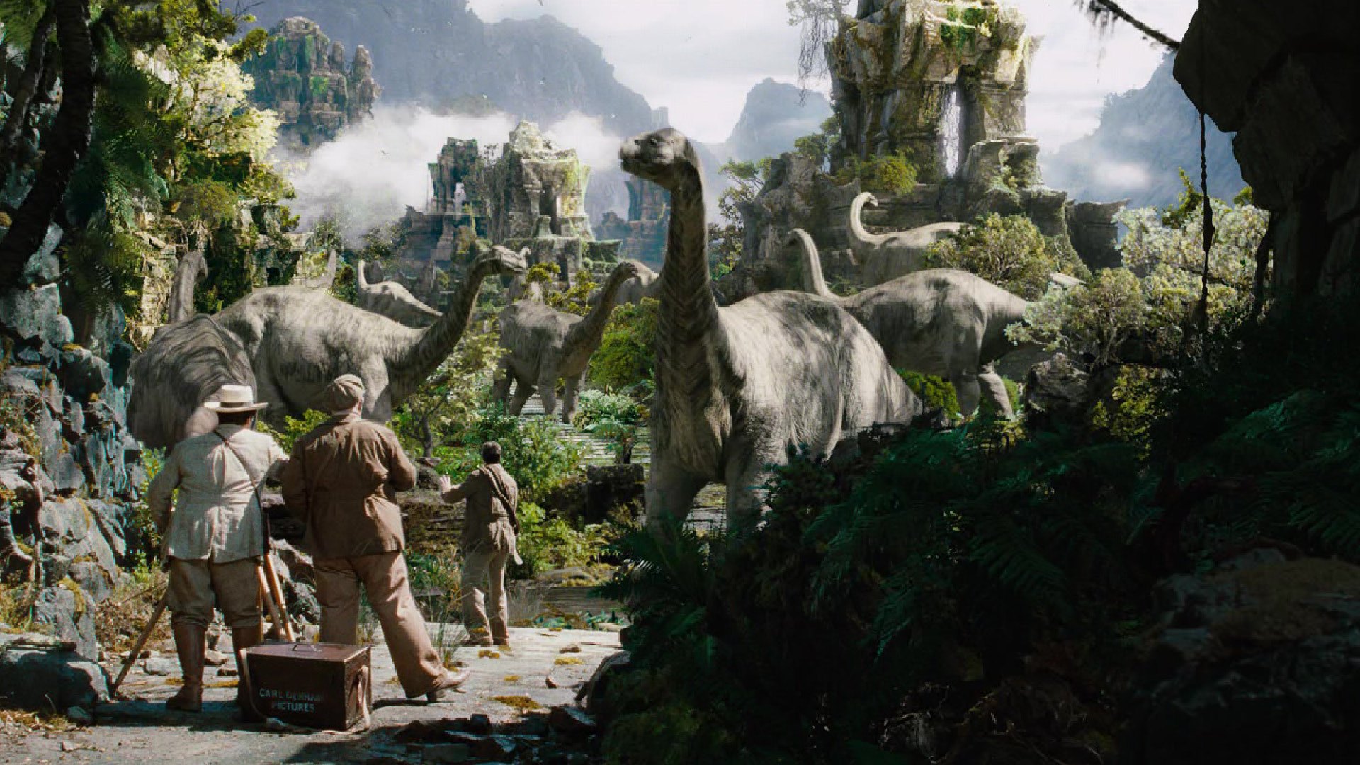 KING KONG film still of 3 explorers and dinosaurs