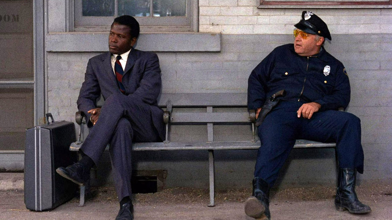 IN THE HEAT OF THE NIGHT film still of Sidney Poitier and Rod Steiger