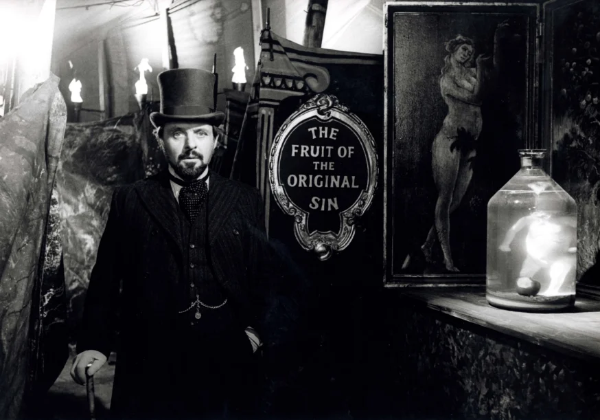 Spotlight-0626-5-Pressbook Dr. Treves (Anthony Hopkins) explores Mr. Bytes’ “freak show.” Source: THE ELEPHANT MAN, Stuart Cornfeld Collection, AFI Archive.